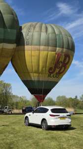 J&B hot air balloon G-BEJB, a Thunder AX6-56A (drink), seen at Pidley, Cambridgeshire, United Kingdom on 25 April 2026. Photograph by Dave