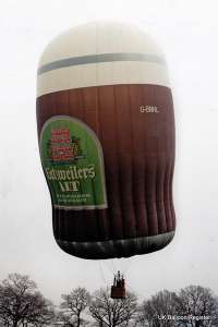 G-BNHL hot air balloon, a Thunder AND Colt Colt Beer Glass. Photograph by Mike Clarke