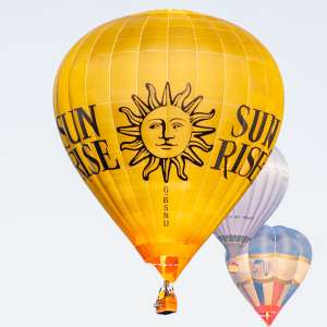 Sun Rise hot air balloon G-BSNU, a Thunder AND Colt Colt 105A (sun), seen at Leigh Woods, North Somerset, United Kingdom on 8 August 2014. Photograph by Dave