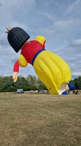 Doll hot air balloon G-BVDF, a Cameron DOLL-105 (snow white, character), seen at Telford, Telford and Wrekin, United Kingdom on 24 August 2025. Photograph by Dave