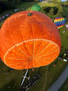Fruit hot air balloon G-CDXW, a Cameron ORANGE-120 (orange, food), seen at Arrow, Warwickshire, United Kingdom on 29 May 2026. Photograph by brad-ox