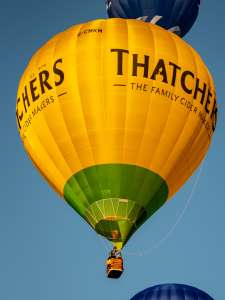 Thatchers hot air balloon G-CMKM, a Cameron Z-105 (drink), seen at City Centre, Bristol, United Kingdom on 20 July 2026. Photograph by Dave