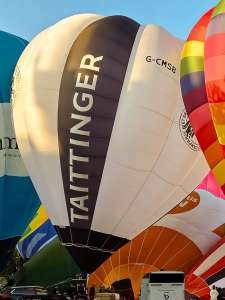Champange hot air balloon G-CMSB, a Cameron O-90 (tattinger, drink), seen at City Centre, Bristol, United Kingdom on 20 July 2026. Photograph by Dave