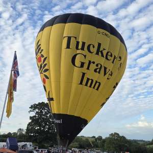 Tuckers Grave Inn hot air balloon G-CNDI, a Diamond S-105, seen at Faulkland, Somerset, United Kingdom on 20 June 2026. Photograph by Dave