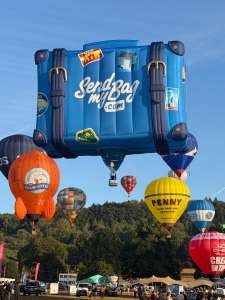 Luggage hot air balloon G-CNDJ, a Cameron Graz BOX-110 (send my bag, suitcase), seen at Ashton Vale, Bristol, United Kingdom on 8 August 2026. Photograph by brad-ox