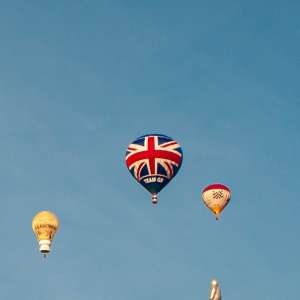 Flag hot air balloon G-GOGB, a Lindstrand HOT AIR Balloons LBL 90A (gb, uk), seen at Leigh Woods, North Somerset, United Kingdom on 8 August 2014. Photograph by Dave