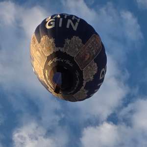 Bath Gin hot air balloon G-INZZ, a Cameron Z-105, seen at Leigh Woods, North Somerset, United Kingdom on 9 August 2026. Photograph by Dave
