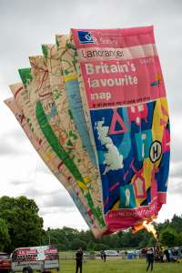 Map hot air balloon G-MAPS, a SKY Flying MAP (ordnance survey), seen at Arrow, Warwickshire, United Kingdom on 31 May 2025. Photograph by Dave