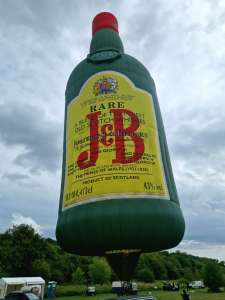J&B hot air balloon G-OJBW, a Lindstrand Balloons LBL J AND B Bottle (drink), seen at Bath and North East Somerset, England, United Kingdom on 19 July 2025. Photograph by Dave