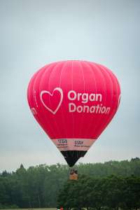 Nhs hot air balloon G-ORGN, a Kubicek Factory S.R.O. BB30Z (organ donation), seen at Arrow, Warwickshire, United Kingdom on 31 May 2025. Photograph by Dave