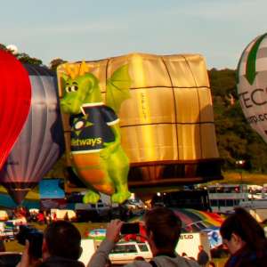 Dragon hot air balloon G-PLLT, a Lindstrand HOT AIR Balloons LBL BOX (animals), seen at Leigh Woods, North Somerset, United Kingdom on 8 August 2014. Photograph by Dave