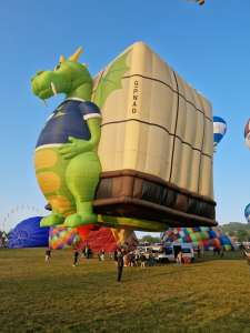 Playreview hot air balloon G-PNAD, a Lindstrand HOT AIR Balloons LBL BOX (dragon, animals), seen at Leigh Woods, North Somerset, United Kingdom on 10 August 2025. Photograph by Dave
