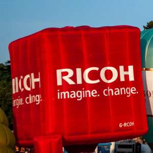 Ricoh hot air balloon G-RCOH, a Cameron CUBE-105, seen at Leigh Woods, North Somerset, United Kingdom on 8 August 2014. Photograph by Dave
