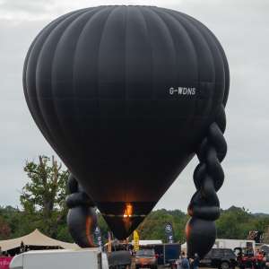 Netflix hot air balloon G-WDNS, a Kubicek Factory S.R.O. BB22Z (Wednesday), seen at Leigh Woods, North Somerset, United Kingdom on 9 August 2025. Photograph by Dave